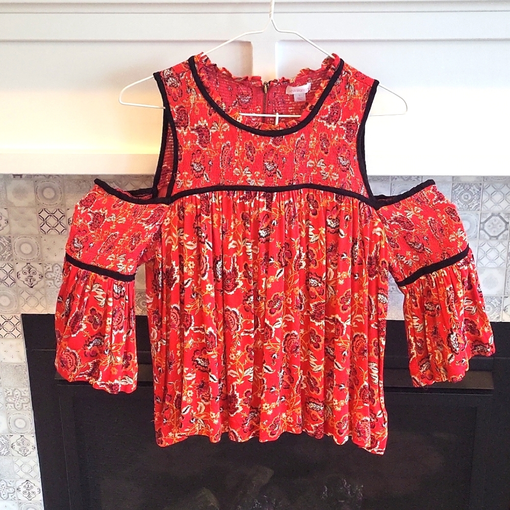 Womens red xhilaration size L with black trim.